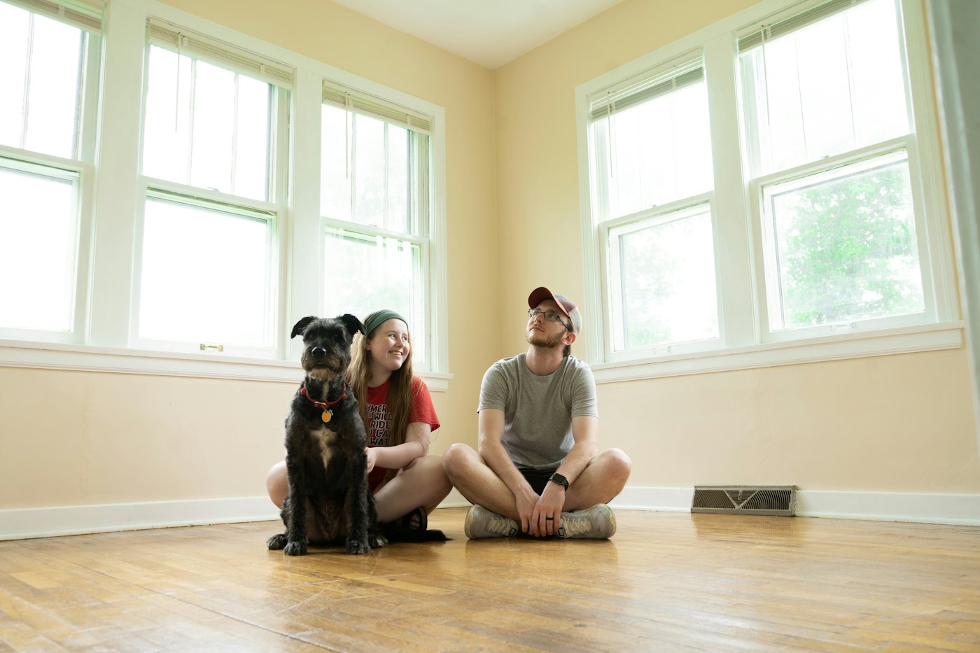Woman sitting on the floor of her new home
